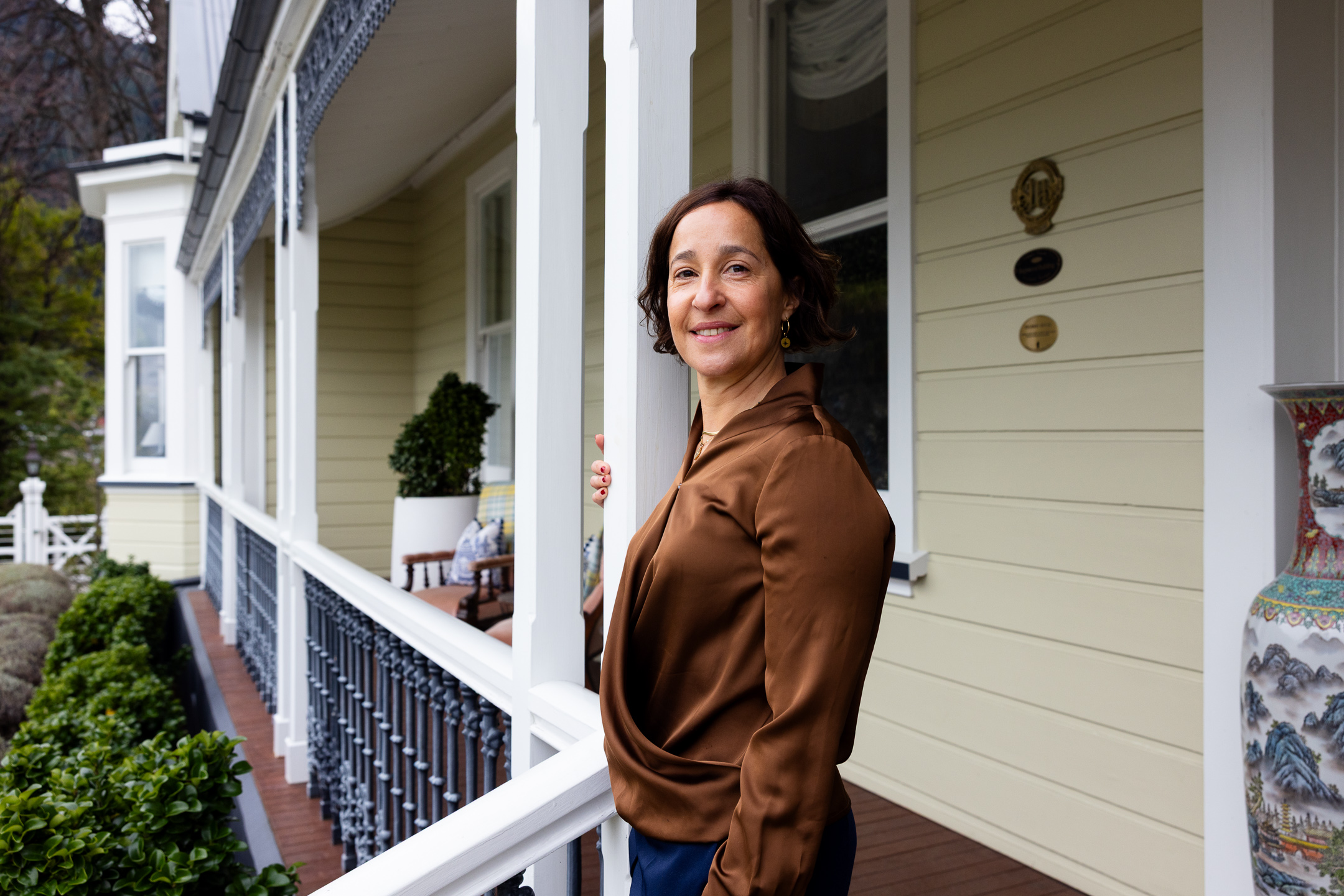 Marina Silva Lodge Manager of Hulbert House standing at the main entrance to the boutique hotel
